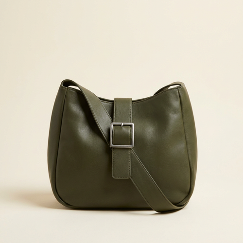 Beatrice buckle shoulder bag in deep olive green against a cream studio backdrop